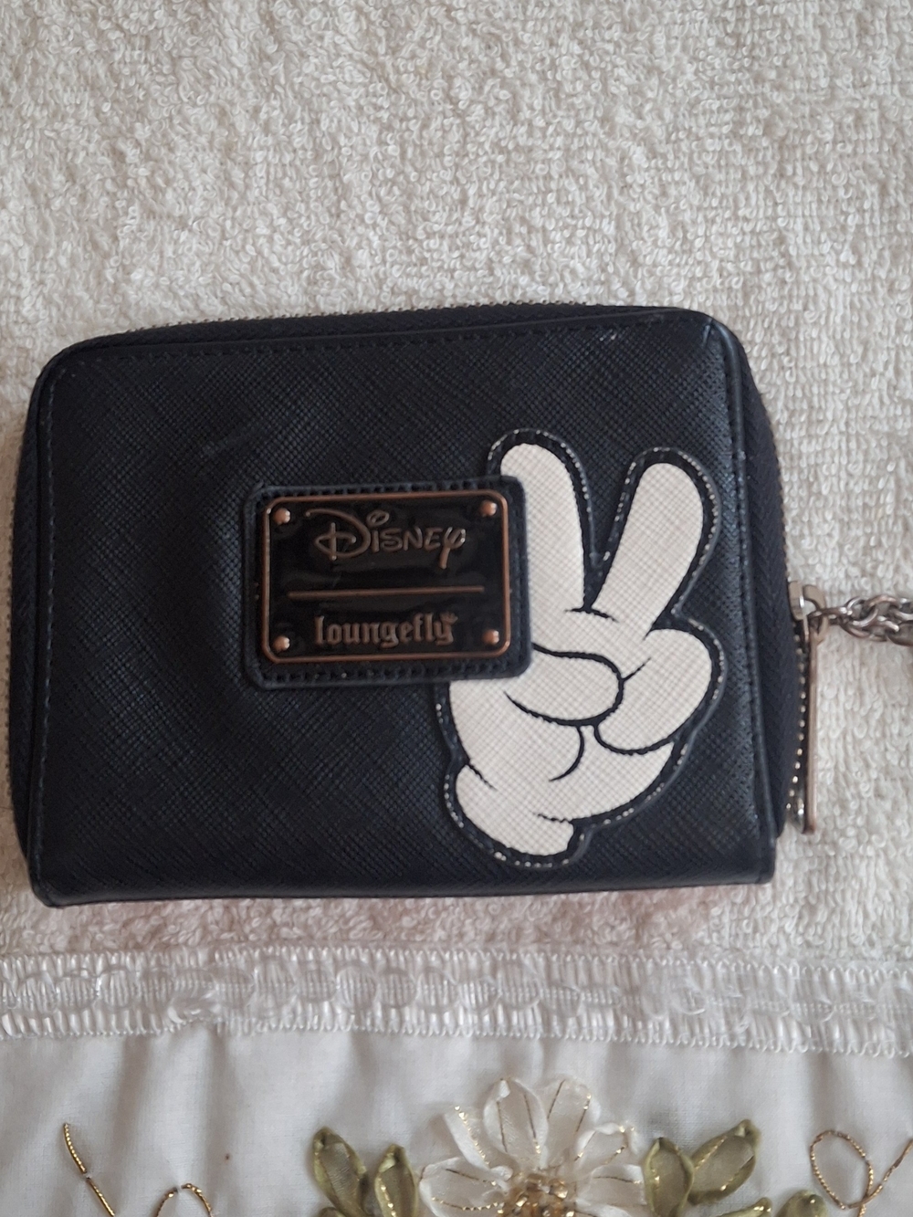 Disney Loungefly zip-around wallet featuring a white Mickey Mouse gloved hand